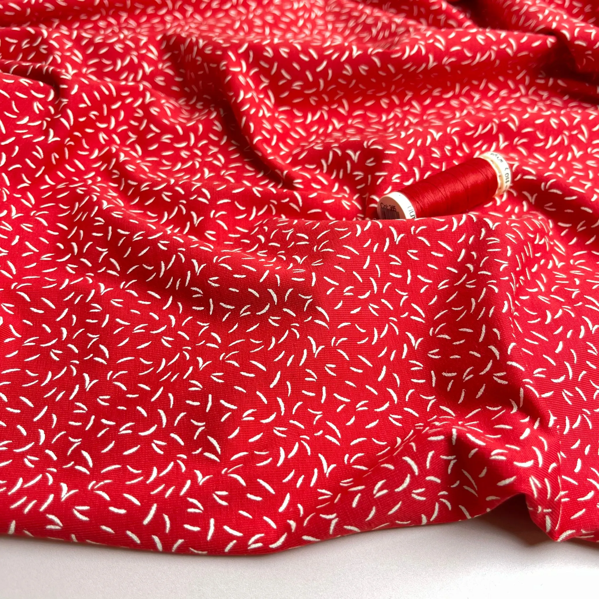 Dashes on Red Cotton Jersey Fabric